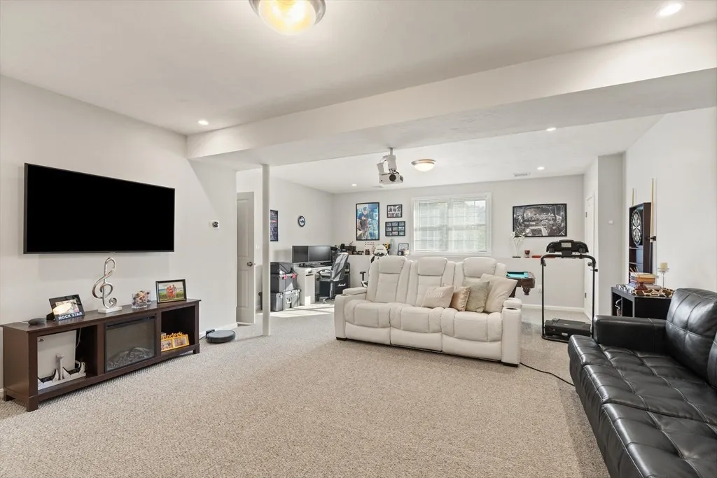 Spacious family room with home theater, full bathroom, and entertainment area.
